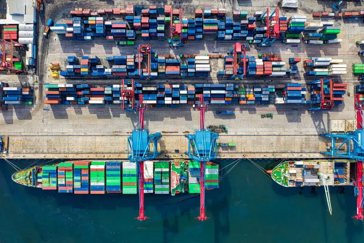 Global cargo logistics terminal coordinating container freight